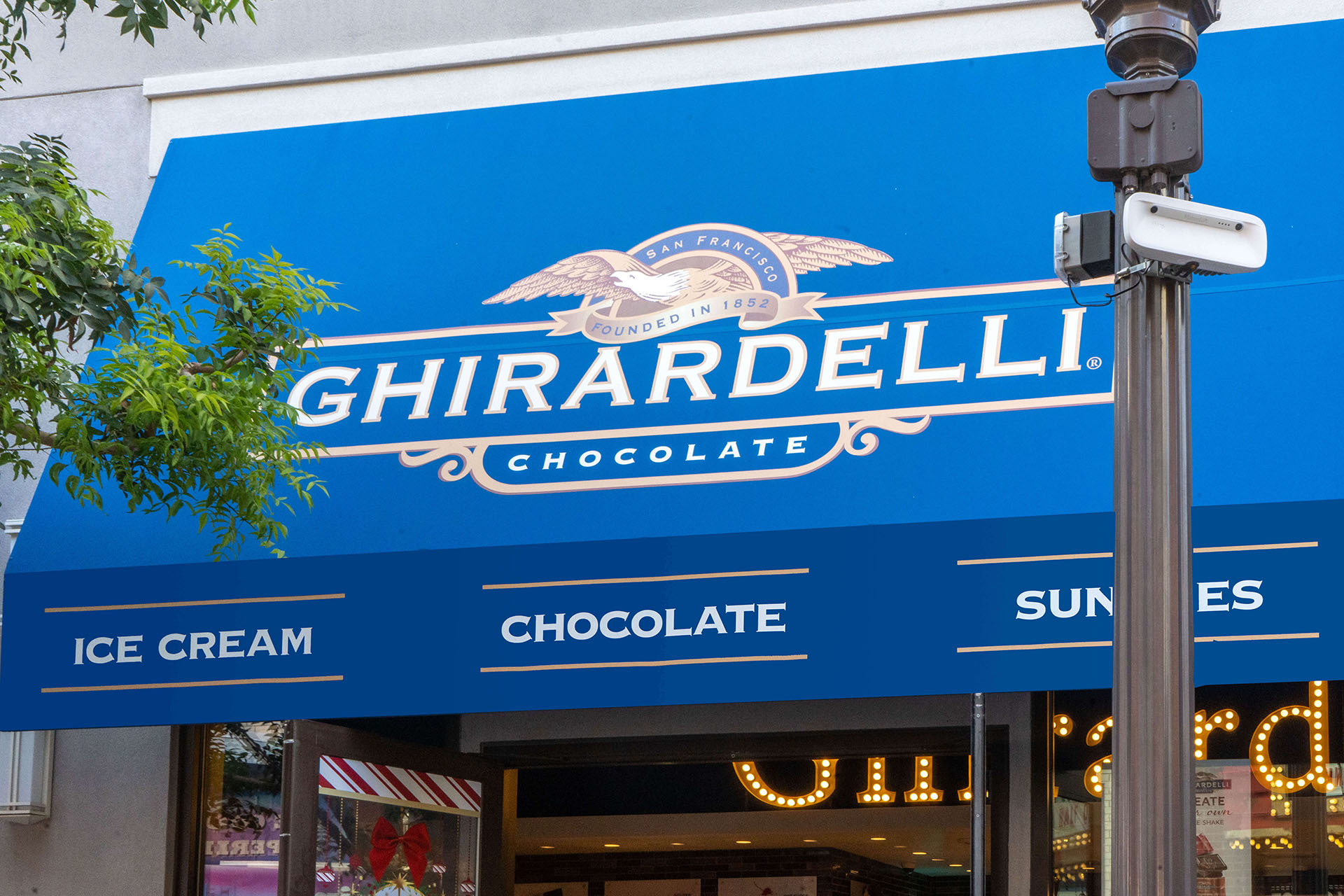 Close-up of Custom Ghirardelli Chocolate Branded Awning System - Designed and Fabricated by Metro Awnings of Las Vegas, Nevada